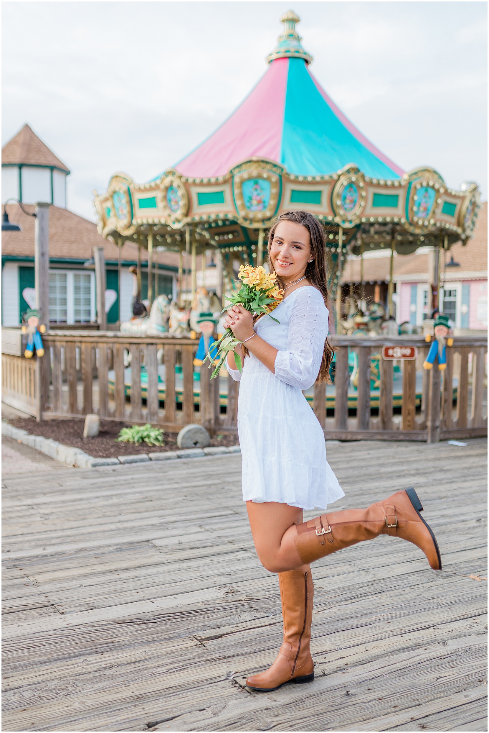 teen girl posing in front of a carousel in smithville, new jersey