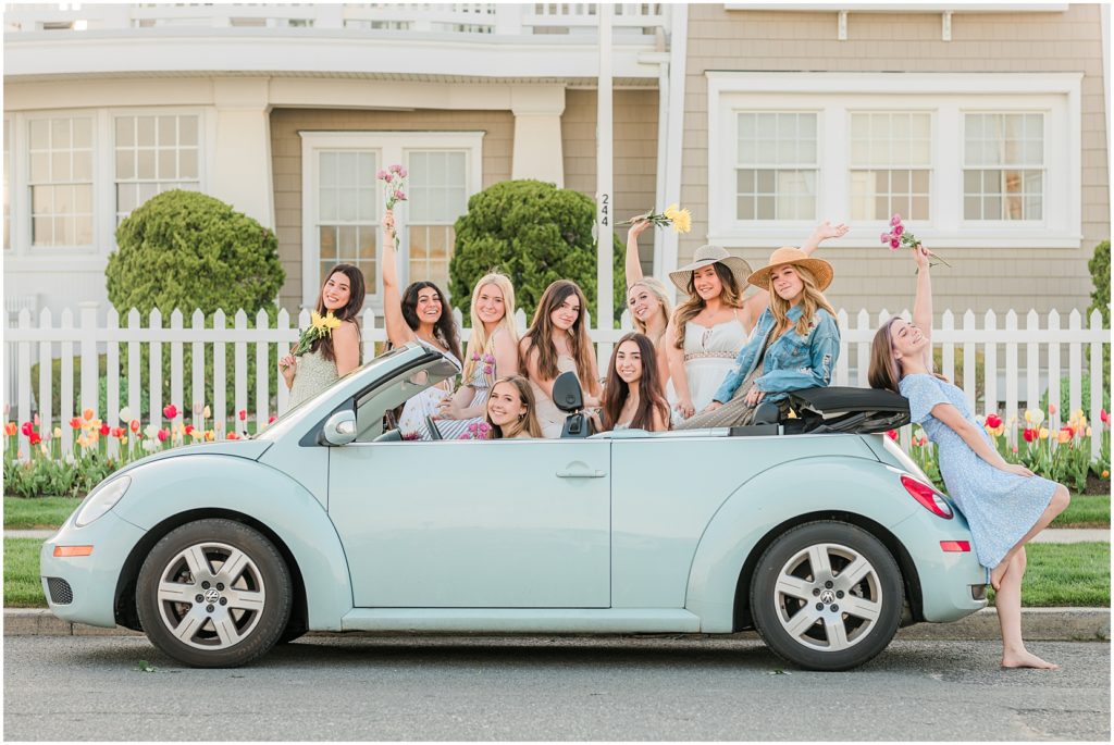senior photoshoot with tulips and a blue buggy in ocean city new jersey