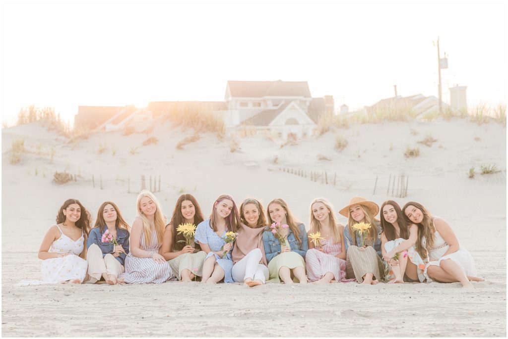 teen girls on the beach with flowers in ocean city new jersey